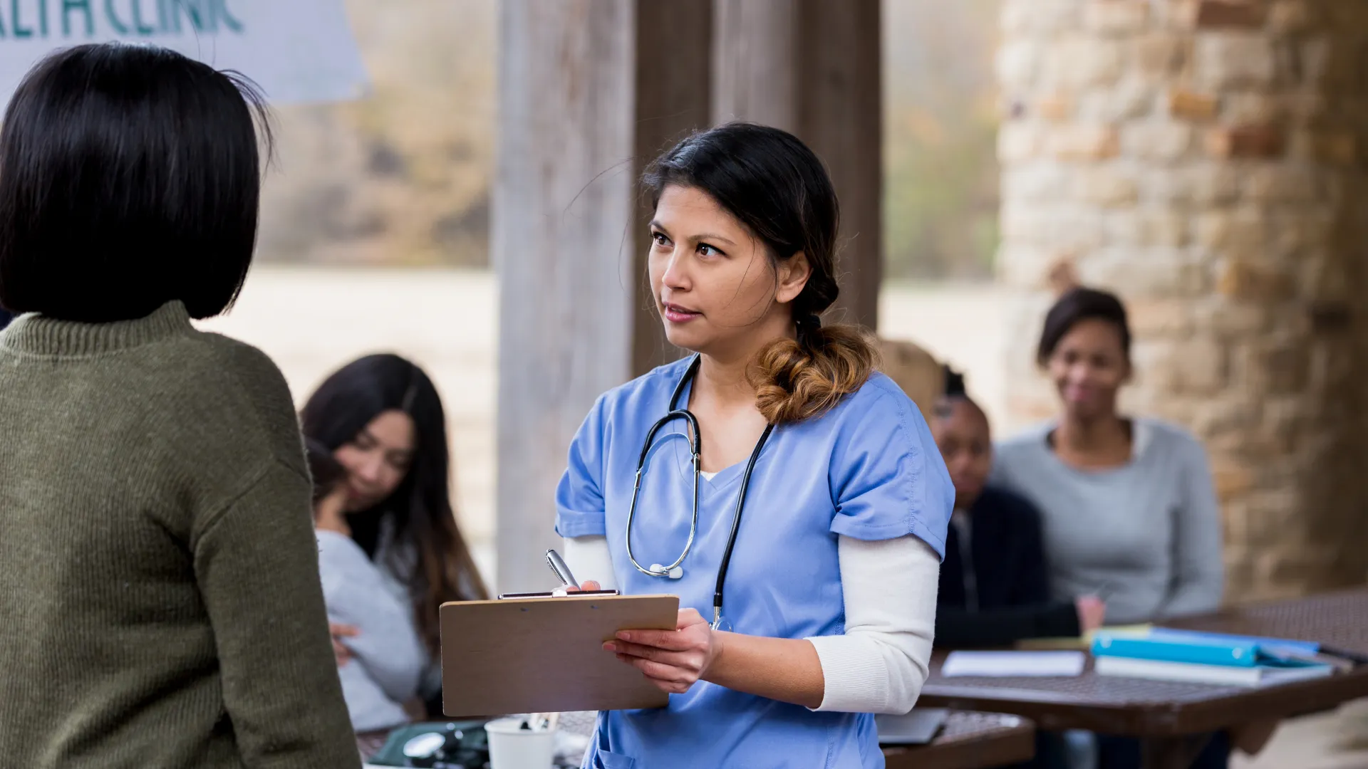 Phlebotomist collecting a sample